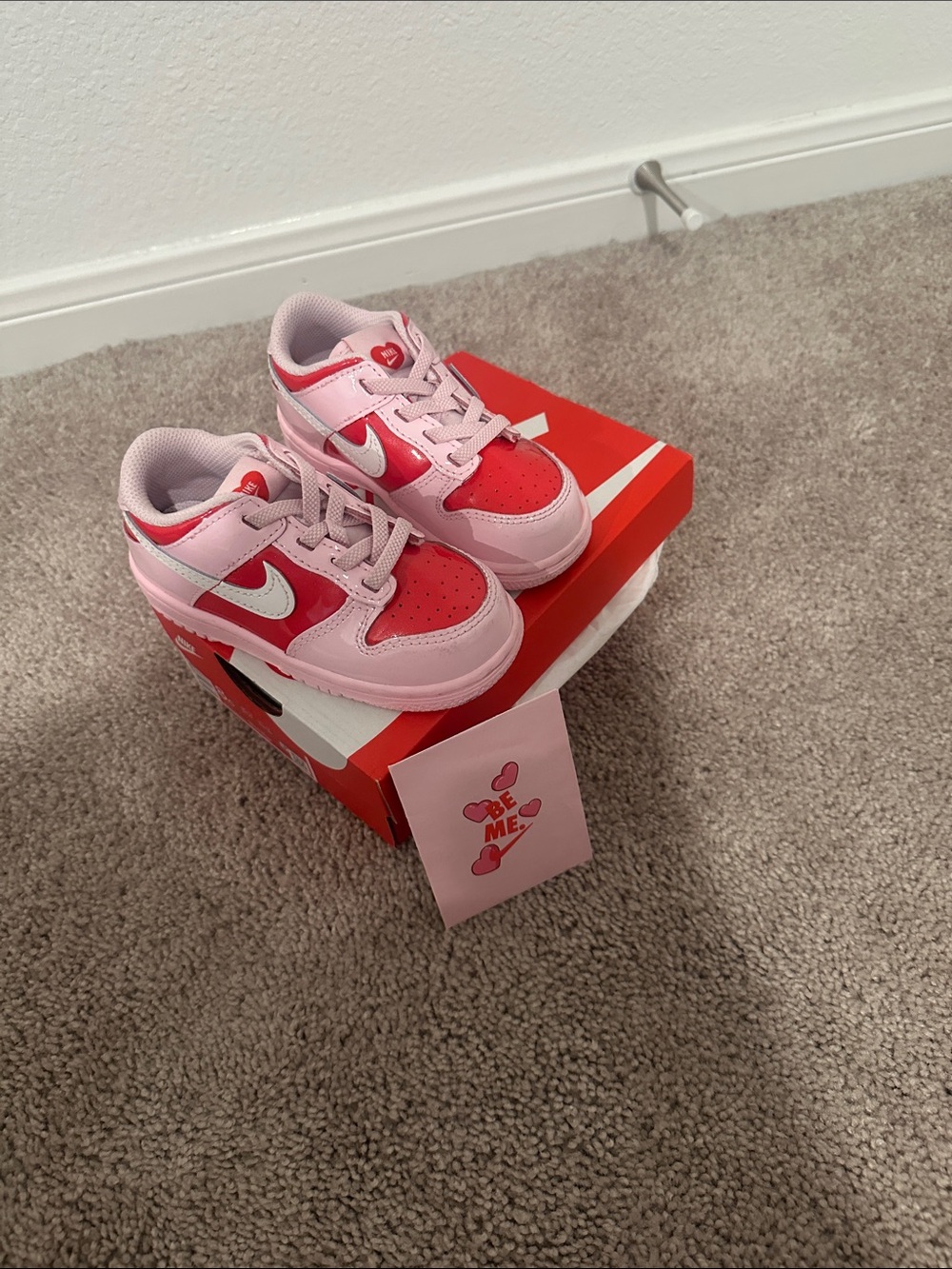 Nike Kids Pink and Red Low-Top Sneakers with White Swoosh